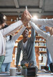 © Prostock-studio - Young afro manager giving high five to his international team, having business meeting in office