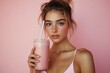 © Lens Harbor - Young sporty girl holding a protein shake isolated on a background, showcasing her fitness lifestyle and commitment to healthy living., Generative AI