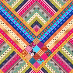 Wall Mural - Boho seamless zigzag patchwork pattern of multicolored stripes and squares with floral and abstract ornament. Beautiful print for fabric in folk style.