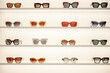 © Westend61 - Colorful sunglasses displayed on shelves in a shop