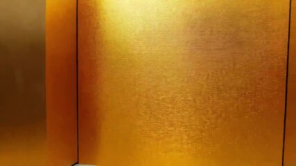 Poster - A textured gold background shows a metallic surface with a shiny and elegant appearance