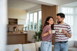 © Migma_Agency - Happy couple enjoying morning coffee in modern apartment