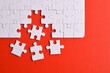 © Mulad Images - White puzzle with missing piece on red background. Flat lay. Top view