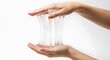 © DFN99 - Viscous beauty product showcases stretching capabilities on woman's hands, Close-up shot of clear sticky substance demonstrating elasticity with hand manipulation