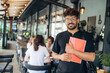 © standret - Front view, standing and posing. Group of young friends are in the cafe restaurant