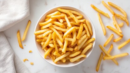 Poster - An overhead shot of a generous serving of  in a white bowl, with some fries arranged neatly and others casually scattered on the white surface.