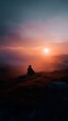 © Bussakon - Lone figure meditating on a hilltop at sunrise
