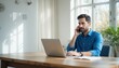 © Chainarong - Man on Phone Call Working from Home Bright Office
