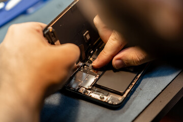 Poster - Expert Phone Technician Repairs Smartphone Hardware While Focusing on Intricate Components in a Bustling Repair Shop