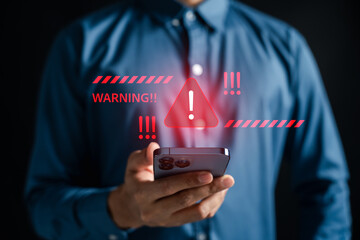 Fototapete - Cybersecurity warning alert on smartphone with red triangle for online danger