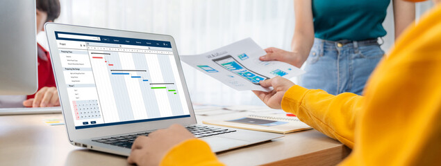 Poster - Project planning software for brisk business project management on the computer screen showing timeline chart of the team project