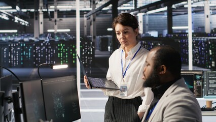Poster - happy data center manager providing positive feedback to engineer developing neural networks softwar