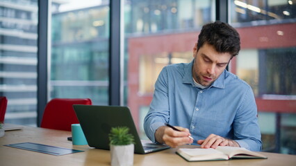 Poster - Busy entrepreneur writing data in notebook browsing laptop at office closeup.