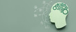© Pixel-Shot - Paper human head with gears on green background with space for text. Concept of brainwork