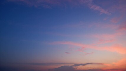 Wall Mural - a stunning sunrise sky timelapse with soft pastel hues of pink and purple blending into clear blue, 