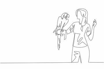 Poster - Single one line drawing blue gold macaw parrot perched on hand of woman. Large parrot with long tail feathers. Grain eaters. Pets. Woman Holding Bird. Continuous line design graphic illustration