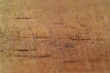 © ahmadiliandy - A close-up view of a rough wooden surface with visible scratch marks and uneven textures.