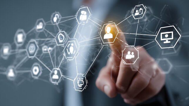 Hand interacting with a digital network of connected icons representing people and technology.
