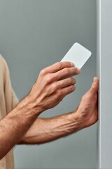 Aufkleber - Modern contactless card access with male hand using keycard on gray smart reader for secure automated entry technology in business and facilities
