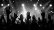 © Lightning - Silhouetted hands raised in worship or celebration at a concert or event