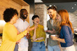 © Westend61 - Coworkers chatting and enjoying a break in a casual office kitchen atmosphere