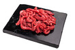 © Mironov - Pieces of Raw beef sliced meat, strips for cooking beef stroganov on board isolated on white background