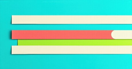 Aufkleber - Colorful paper strips overlap turquoise background. Simple composition, flat lay style, vibrant hues present. Minimalist aesthetic.