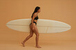 © Marek - Female surfer in studio