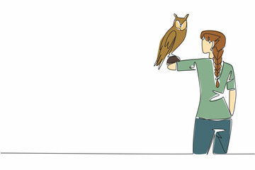Poster - Continuous one line drawing long eared owl perched on hand of woman. Animals that really like shrubs. Has long ears. Stable population. Woman Holding Bird. Single line draw design vector illustration