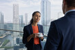 © ReeldealHD images - Business Meeting in Modern Cityscape