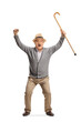 © Ljupco Smokovski - Overjoyed elderly man holding a cane and gesturing happiness