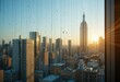 © Kiryakova Anna - Raindrops on window with cityscape and sunrise in background at golden hour.