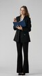 © kinomaster - Young Professional Woman Holding a Blue Notebook Smiling isolated on white background
