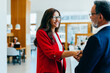 © (JLco) Julia Amaral - Business professionals shaking hands in an office setting