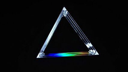 Wall Mural - A triangular prism projecting a beam of rainbow light into a dark background. The contrast between the vivid colors and the surrounding darkness creates a striking and dramatic visual