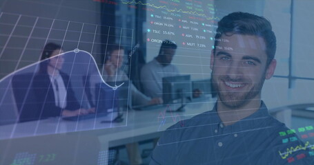 Poster - Smiling man wearing blue shirt using laptop at desk in office, with digital stock chart overlays