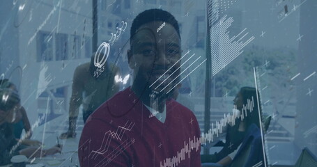 Poster - Smiling man in office with financial data processing image overlay