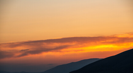 Wall Mural - Beautiful sunset with clouds over the lake.