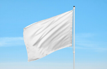 Poster - White flag waving against clear blue sky, symbol of peace, freedom, or surrender, ideal for editorial or visual content needs