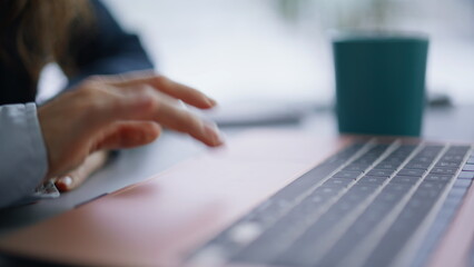 Wall Mural - Finger touching laptop surfing internet workplace closeup. Businesswoman working
