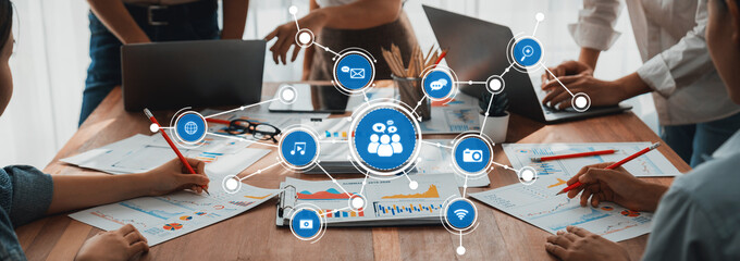 Poster - Analyst team utilizing BI Fintech to analyze and pointing at financial dashboard paper office. Businesspeople examining report paper on table for business insight. Panorama shot. Scrutinize Amity
