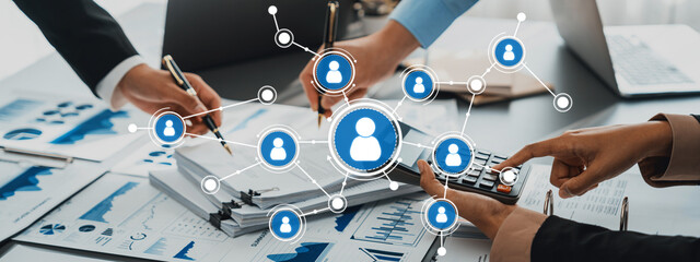 Poster - Collaborative Business Networking Concept with Team Working on Financial Data and Charts Illustrating Connections and Relationships in a Modern Office Setting. Amity