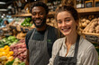 © Audrey - Smiling woman in apron stands at grocery store aisle. Fresh food on shelves behind. Smiling staff member poses looking at camera. Supermarket shopping concept.