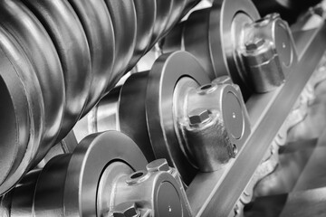 Poster - track Tractor on roller close up machine part many bolts and screws сoncept complexity precision, many parts fasteners work together create functioning machine