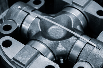 Poster - Close up of a metal piece with a silver band wrapped around it. The piece is a part of a machine and the band is used to hold it together