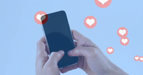 Poster - Holding smartphone with image of floating heart icons on blue background