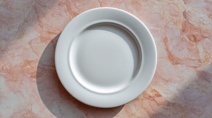 Poster - Elegant white plate on a textured pink surface, showcasing simplicity in design and form, ideal for food photography and product displays in various culinary contexts.
