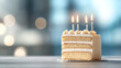 © venusvi - A delicious birthday cake with four candles stands elegantly in a blurred background, perfect for celebrations and special moments.