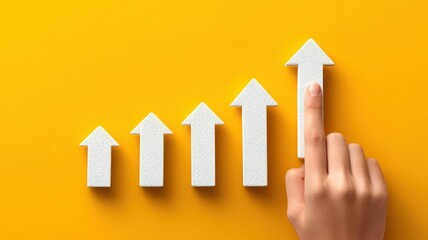 Poster - Personal finance development. Hand pointing at ascending arrows on a vibrant yellow background, symbolizing growth and progress.