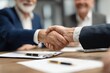 © DIMENSIONS - Business Professionals Handshake at Meeting Table Symbolizing Successful Partnership and Trustworthy Collaboration in Corporate Environment